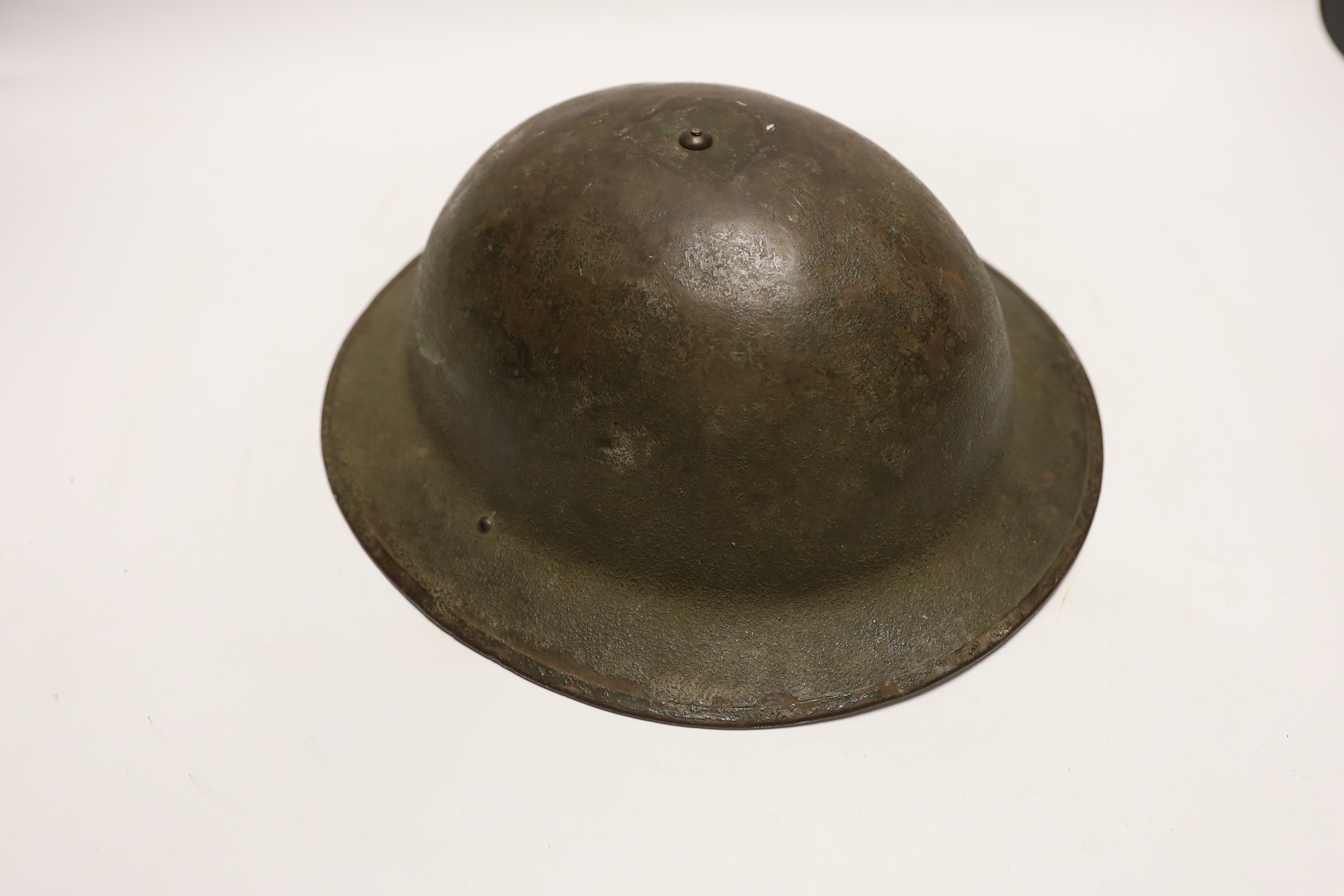 A WWII helmet and a gas mask